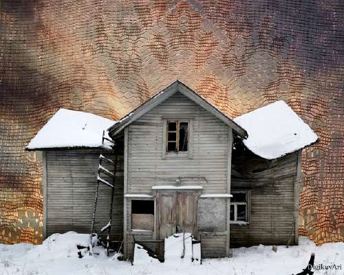 The first snow on the roof of a deserted house.