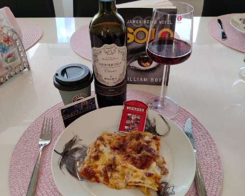 007 Food: A portion of lasagne and a glass of...