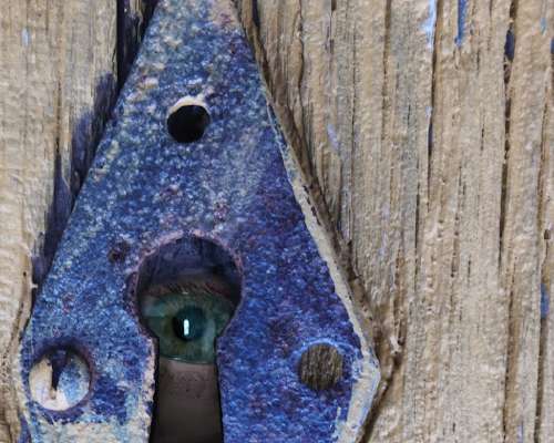 Eye Looking Through Keyhole